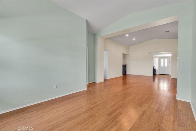 197 Potter Crk, Beaumont, CA 92223 - unfurnished living room featuring vaulted ceiling, light wood-style floors, and baseboards