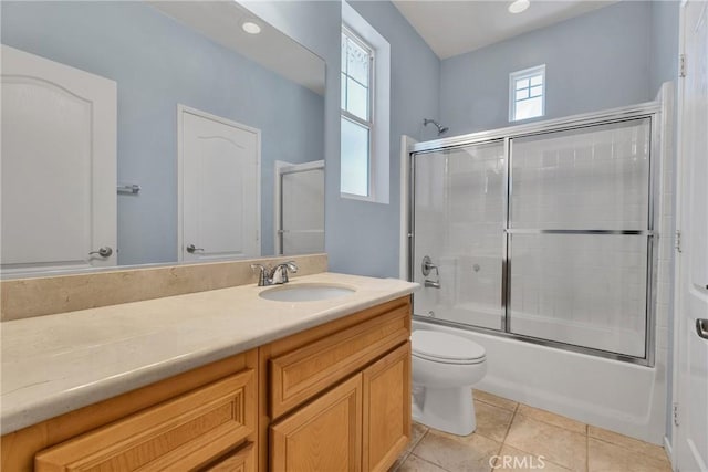 197 Potter Crk, Beaumont, CA 92223 - bathroom with vanity, toilet, combined bath / shower with glass door, and tile patterned floors