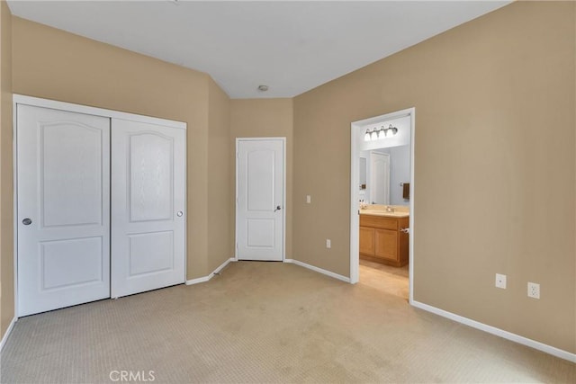 197 Potter Crk, Beaumont, CA 92223 - unfurnished bedroom featuring light carpet, baseboards, a closet, and ensuite bath