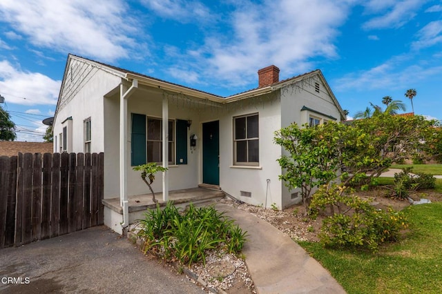 8528 Palma Vista St, San Gabriel, CA 91775 - view of front of property featuring a chimney, crawl space, stucco siding, and fence