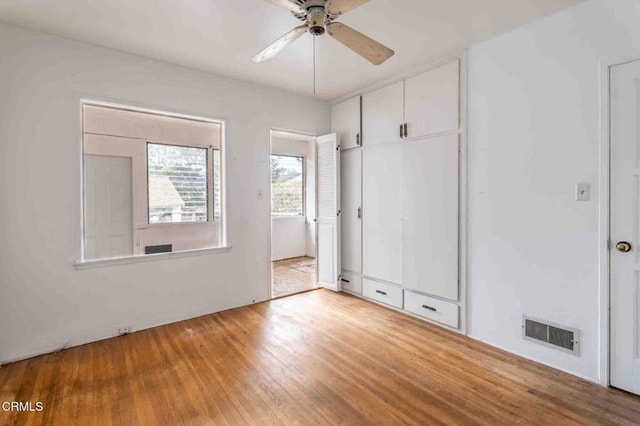 8528 Palma Vista St, San Gabriel, CA 91775 - unfurnished bedroom with wood finished floors, a closet, and a ceiling fan