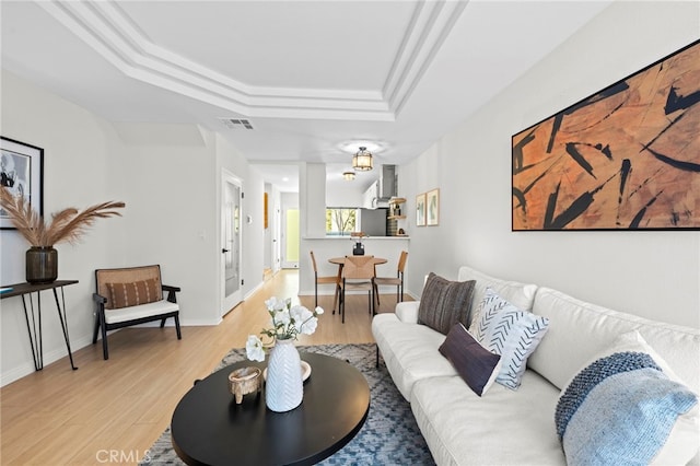 2500 Abbot Kinney Blvd Unit 9, Venice, CA 90291 - living area with light wood-type flooring, a tray ceiling, and baseboards
