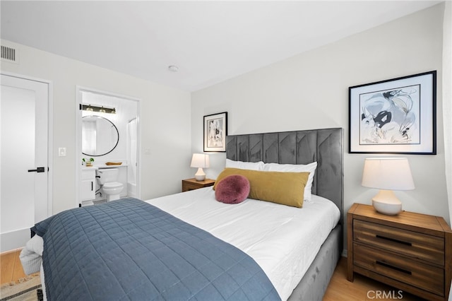 2500 Abbot Kinney Blvd Unit 9, Venice, CA 90291 - bedroom with wood finished floors and ensuite bathroom