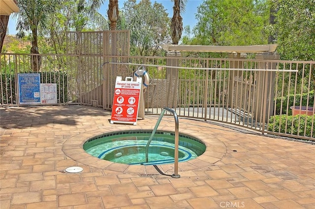 2040 Las Colinas Cir Unit 104, Corona, CA 92879 - view of swimming pool with a community hot tub and fence