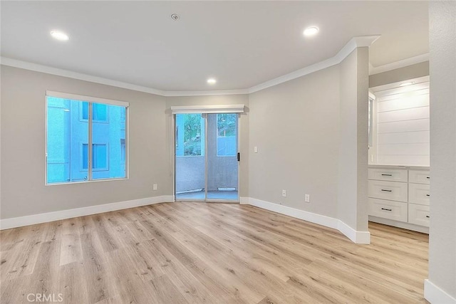 2040 Las Colinas Cir Unit 104, Corona, CA 92879 - empty room featuring crown molding, light wood-style flooring, baseboards, and recessed lighting