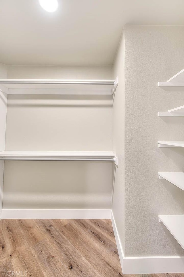 2040 Las Colinas Cir Unit 104, Corona, CA 92879 - spacious closet with wood finished floors