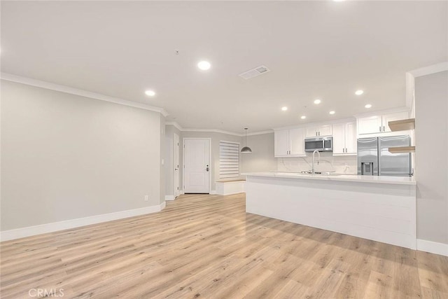2040 Las Colinas Cir Unit 104, Corona, CA 92879 - unfurnished living room featuring ornamental molding, recessed lighting, baseboards, and light wood-type flooring