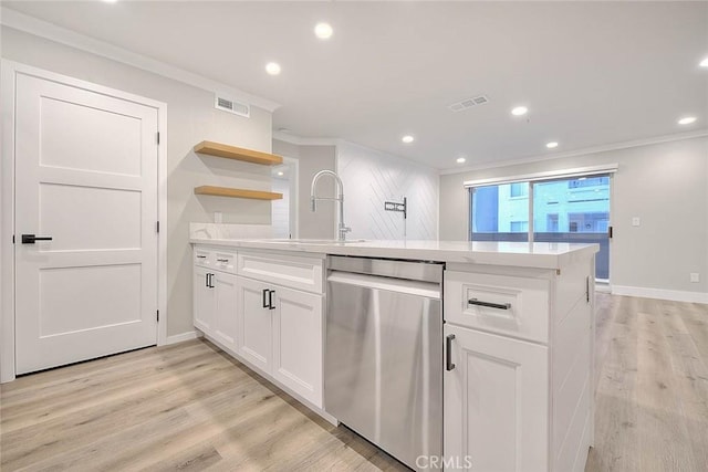 2040 Las Colinas Cir Unit 104, Corona, CA 92879 - kitchen featuring stainless steel dishwasher, a sink, ornamental molding, white cabinets, and light wood-type flooring