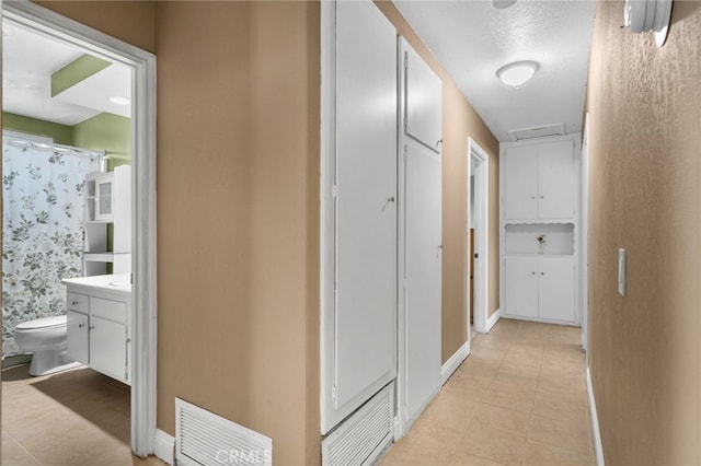 8631 Holly St, Rancho Cucamonga, CA 91701 - hall with baseboards and light tile patterned floors
