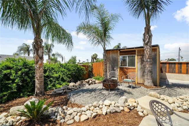 8631 Holly St, Rancho Cucamonga, CA 91701 - fenced backyard featuring an outdoor fire pit