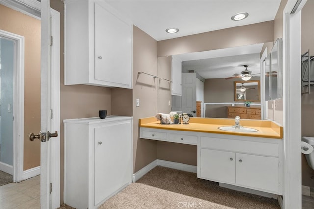 8631 Holly St, Rancho Cucamonga, CA 91701 - bathroom with baseboards, a ceiling fan, and vanity