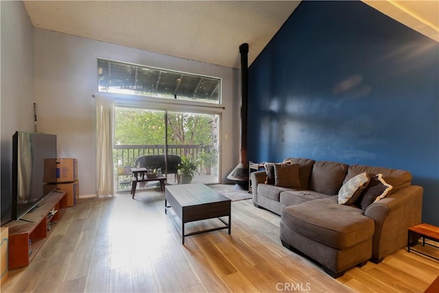 7890 E Spring St Unit 18D, Long Beach, CA 90815 - living room with light wood finished floors and lofted ceiling