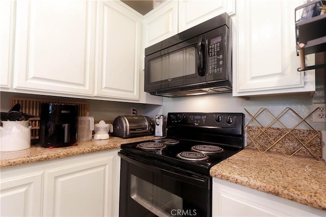 7890 E Spring St Unit 18D, Long Beach, CA 90815 - kitchen with black appliances and white cabinetry
