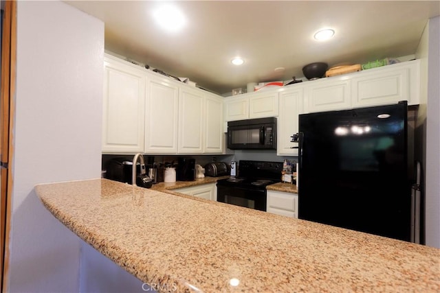 7890 E Spring St Unit 18D, Long Beach, CA 90815 - kitchen with black appliances, white cabinets, light stone counters, and recessed lighting
