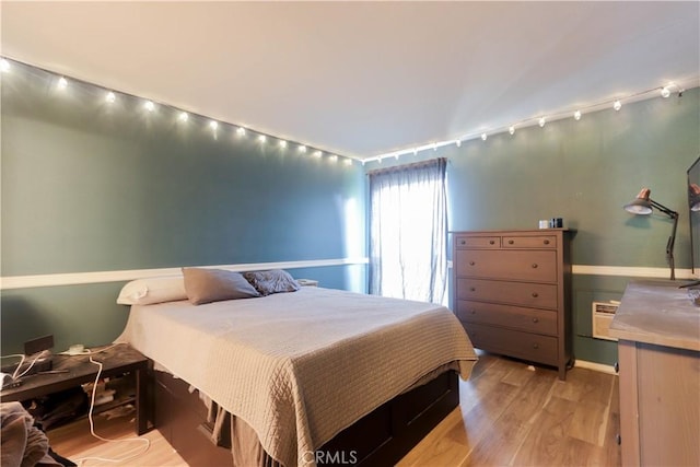 7890 E Spring St Unit 18D, Long Beach, CA 90815 - bedroom featuring light wood-style floors and baseboards