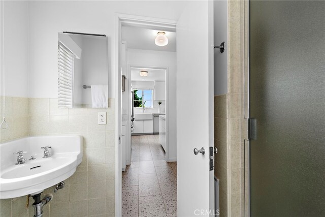 2142 Ruby Pl, Laguna Beach, CA 92651 - bathroom with a sink, a stall shower, and tile walls