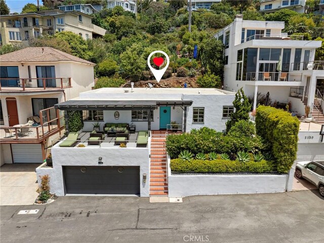 2142 Ruby Pl, Laguna Beach, CA 92651 - view of property with a garage, stairs, and concrete driveway