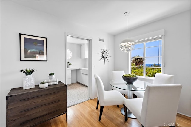 2142 Ruby Pl, Laguna Beach, CA 92651 - dining space with a chandelier and light wood-style floors