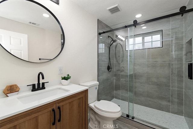 1988 Thornton St, Riverside, CA 92507 - bathroom with toilet, vanity, a stall shower, and recessed lighting
