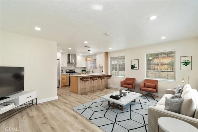 1988 Thornton St, Riverside, CA 92507 - living area with recessed lighting, light wood-type flooring, and baseboards