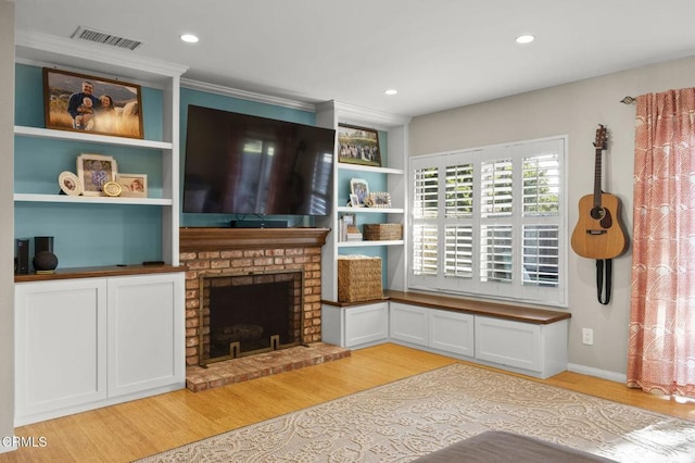 825 Murdoch Ln, Ventura, CA 93003 - living room featuring light wood-style floors, a brick fireplace, and recessed lighting