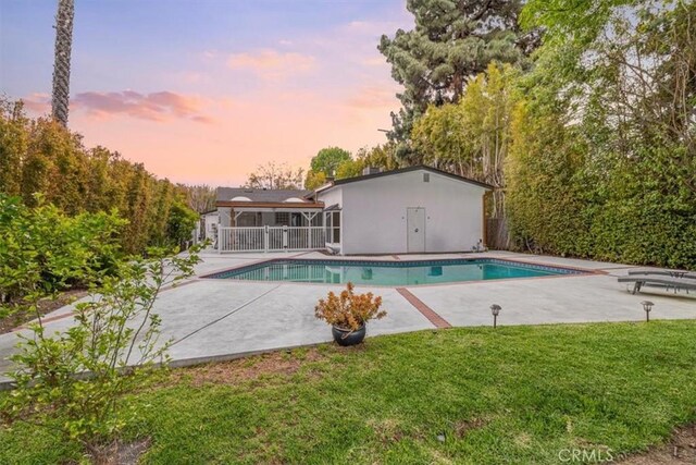 12535 Kling St, Studio City, CA 91604 - pool at dusk with a patio area and an outdoor pool