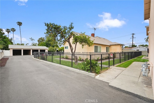 3065 Sastre Ave, El Monte, CA 91733 - view of front of house featuring a garage, stucco siding, and a chimney
