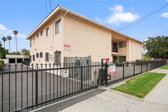 3065 Sastre Ave, El Monte, CA 91733 - view of property exterior featuring stucco siding and a fenced front yard