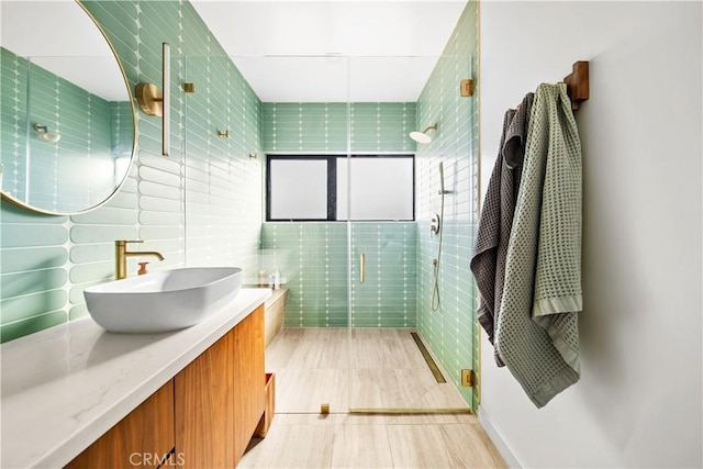4756 Keniston Ave, Los Angeles, CA 90043 - bathroom featuring tile walls, vanity, a shower stall, and tile patterned flooring