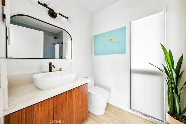4756 Keniston Ave, View Park, CA 90043 - full bathroom featuring vanity, an enclosed shower, and toilet