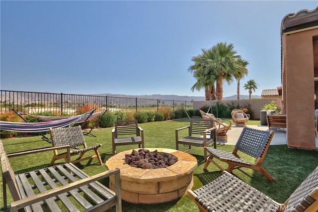 84692 Pavone Way, Indio, CA 92203 - view of patio / terrace featuring a fire pit and a mountain view