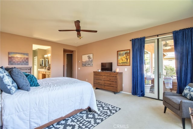 84692 Pavone Way, Indio, CA 92203 - bedroom with access to exterior, light carpet, ensuite bathroom, baseboards, and ceiling fan