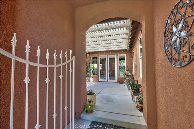 84692 Pavone Way, Indio, CA 92203 - entrance to property with stucco siding, a pergola, and french doors