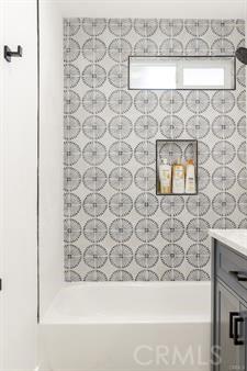 10290 Monte Vista Ave, Montclair, CA 91763 - full bathroom with a tub, vanity, and a shower