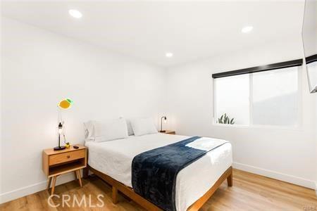 10290 Monte Vista Ave, Montclair, CA 91763 - bedroom featuring baseboards, wood finished floors, and recessed lighting