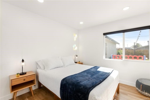 10290 Monte Vista Ave, Montclair, CA 91763 - bedroom featuring baseboards, wood finished floors, and recessed lighting