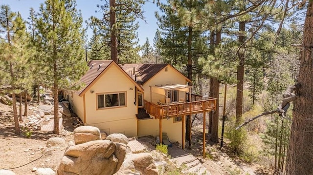 38855 Big Bear Blvd, Big Bear Lake, CA 92315 - rear view of property featuring a wooden deck and stucco siding