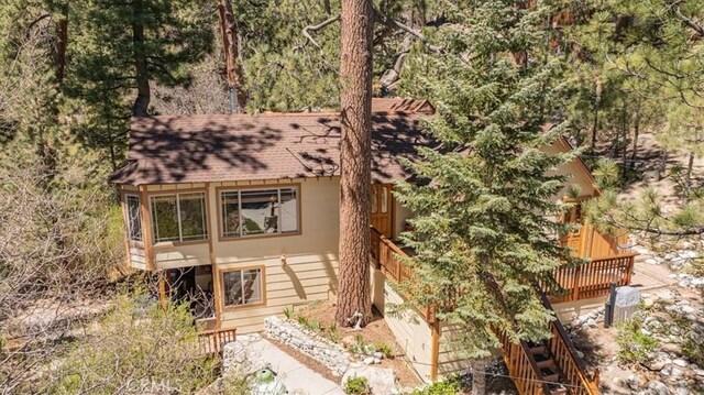 38855 Big Bear Blvd, Big Bear Lake, CA 92315 - view of front facade with roof with shingles and a wooden deck