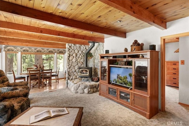 38855 Big Bear Blvd, Big Bear Lake, CA 92315 - living room featuring a wood stove, wooden ceiling, beam ceiling, and carpet
