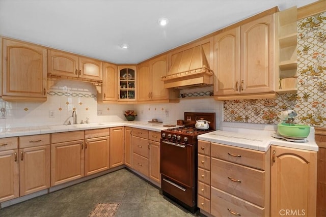 38855 Big Bear Blvd, Big Bear Lake, CA 92315 - kitchen with custom range hood, black gas range, a sink, and light brown cabinetry