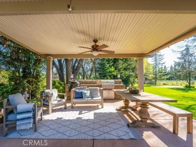 25179 68th Ave, Los Molinos, CA 96055 - view of patio / terrace with exterior kitchen, a ceiling fan, grilling area, and view of scattered trees