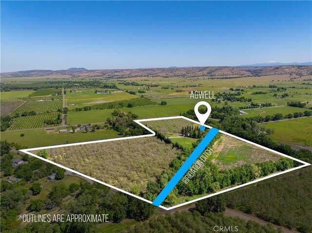 25179 68th Ave, Los Molinos, CA 96055 - overview of rural landscape featuring property parcel outlined and a mountainous background