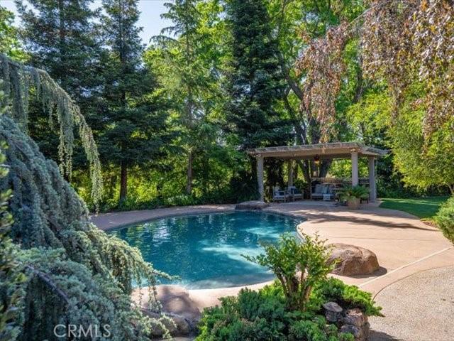 25179 68th Ave, Los Molinos, CA 96055 - outdoor pool featuring a patio area and a pergola