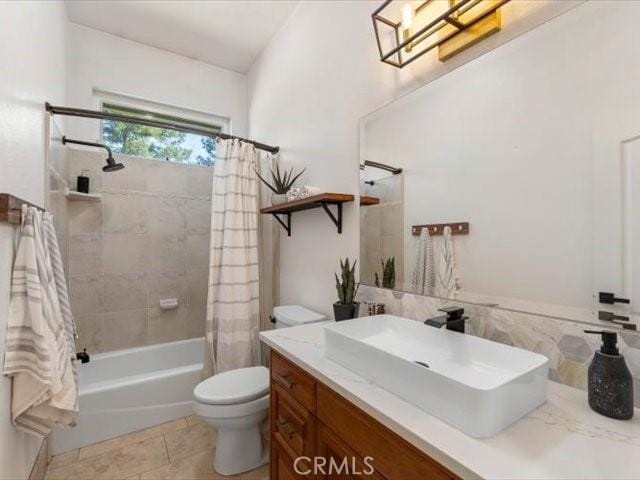25179 68th Ave, Los Molinos, CA 96055 - full bath featuring toilet, tile patterned floors, vanity, and shower / bath combination with curtain