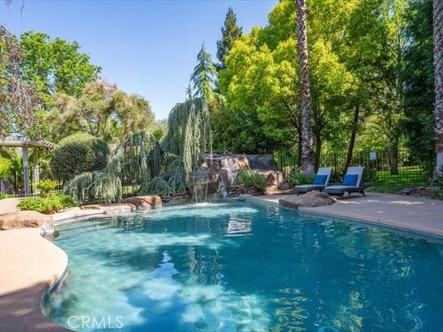 25179 68th Ave, Los Molinos, CA 96055 - view of swimming pool featuring fence and a patio