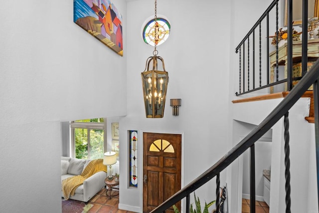979 Canyon Heights Rd, Fallbrook, CA 92028 - tiled foyer with a towering ceiling, a chandelier, and stairs