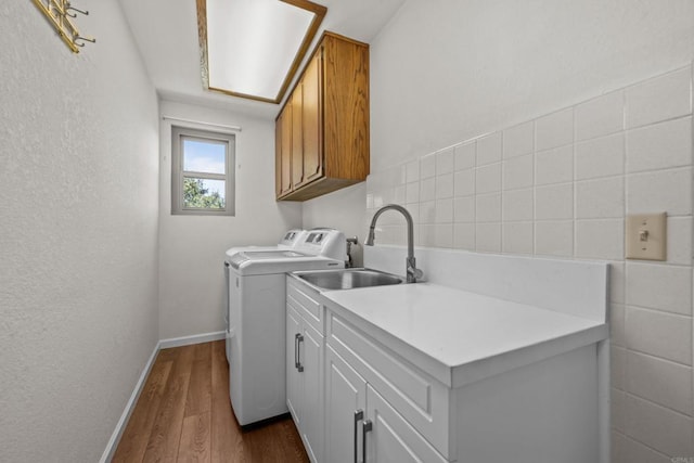 979 Canyon Heights Rd, Fallbrook, CA 92028 - laundry area with cabinet space, dark wood-style flooring, baseboards, separate washer and dryer, and a textured wall