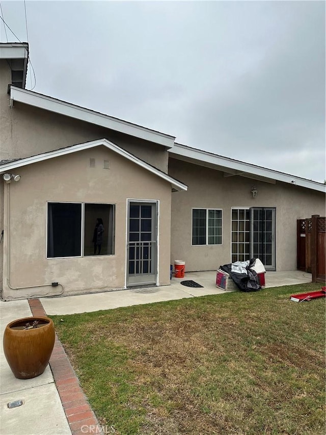 1940 E Walnut Crk, West Covina, CA 91791 - rear view of house featuring stucco siding, a yard, and a patio area