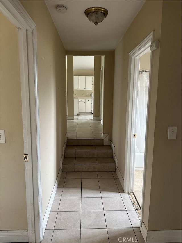 1940 E Walnut Crk, West Covina, CA 91791 - corridor with light tile patterned flooring and baseboards