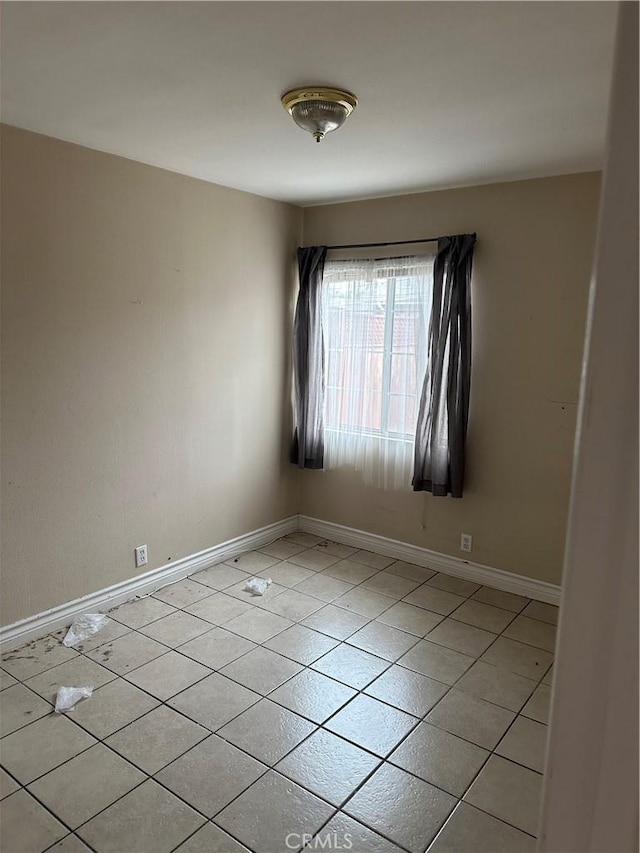 1940 E Walnut Crk, West Covina, CA 91791 - empty room with baseboards and light tile patterned floors